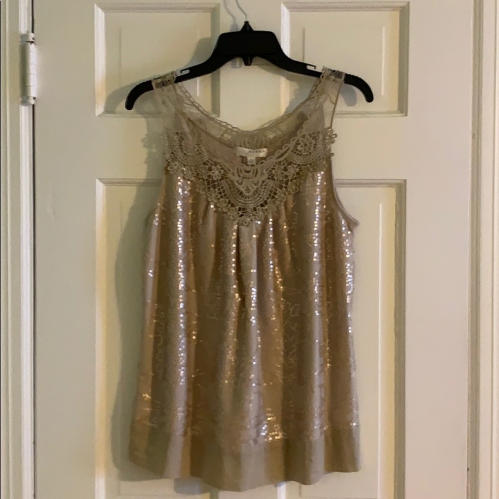 Taupe/gold sleeveless top.